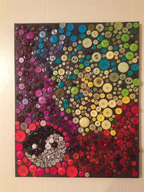 A Painting Made Out Of Buttons On A Wall