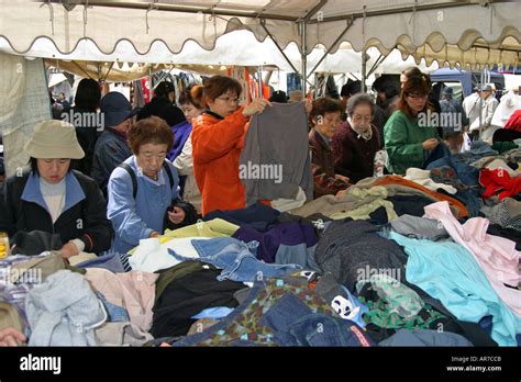 Japanese Woman Shop For Bargains At A Second Hand Kimono Stall At Shi