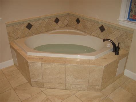 Installing a tub surround around a whirlpool tub can be a little more complicated than installing a typical tub. Whirlpool tub | Small bathroom, Corner tub, Fancy bathroom