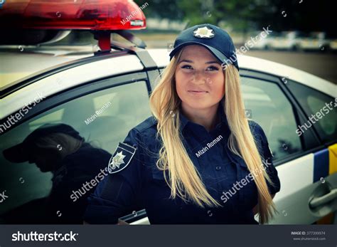 Beautiful Police Girl Posing In Park And At The Police Station Stock