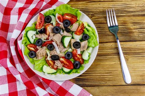 Tasty Tuna Salad With Lettuce Black Olives And Fresh Vegetables On