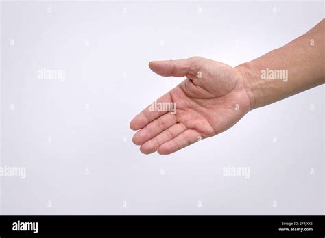 Male Hand Reaching Down Open Palm To Help Gesture Isolated On White