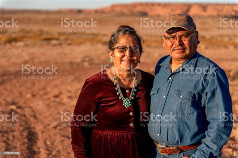 A Happy Smiling Native American Husband And Wife Near Their Home In Monument Valley Utah Stock