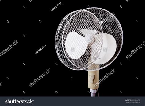 White Electric Broken Fan Isolated On Black Background Stock Photo