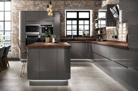 Dark kitchens: black, navy and dark grey kitchen ideas ... Modern white kitchen in luxury home with marble granite kitchen island and glass ball pendant lights.