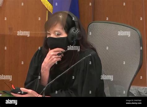 In this screen grab from video, Hennepin County Judge Regina Chu dons a