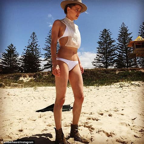 Amber Heard Shows Off Her Slender Figure In A White Bikini Daily Mail