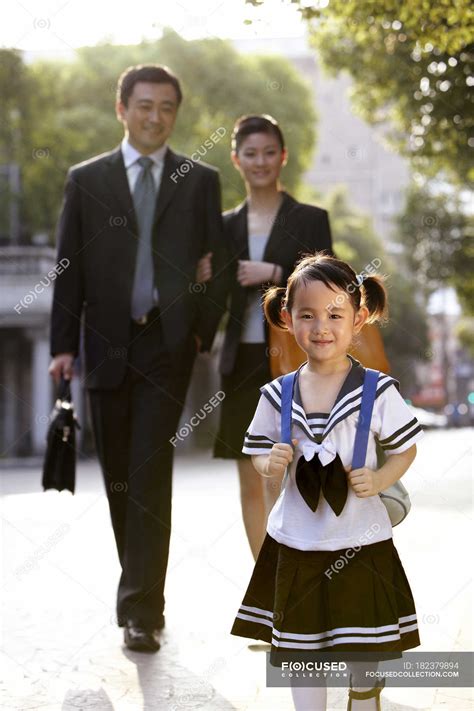 Chinese Parents Walking With Schoolgirl On Street — Residential District Businesswoman Stock