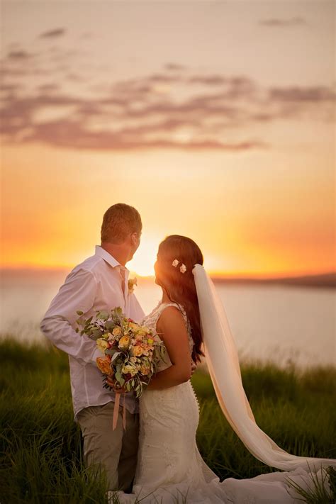 We Love This Beautiful Photo Of The Bride And Groom Overlooking The Sunset Sunset Wedding