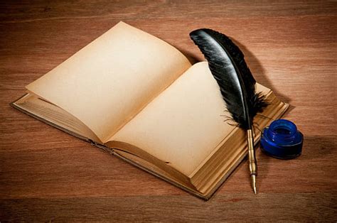 Open Book With Feather Pen Stock Photos Pictures And Royalty Free Images