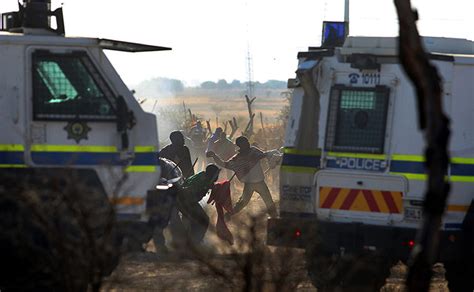 south african police open fire on striking miners in…