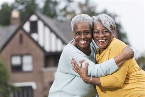 Two Senior Black Women Hugging Call To Safety