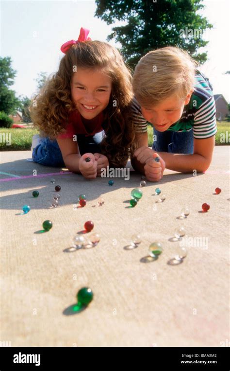 Brother Sister Playing Marbles Together Hi Res Stock Photography And