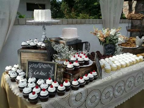 A Table Topped With Lots Of Cupcakes And Cakes