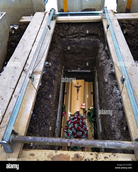 A Coffin Shortly After The Funeral In An Open Grave Stock Photo