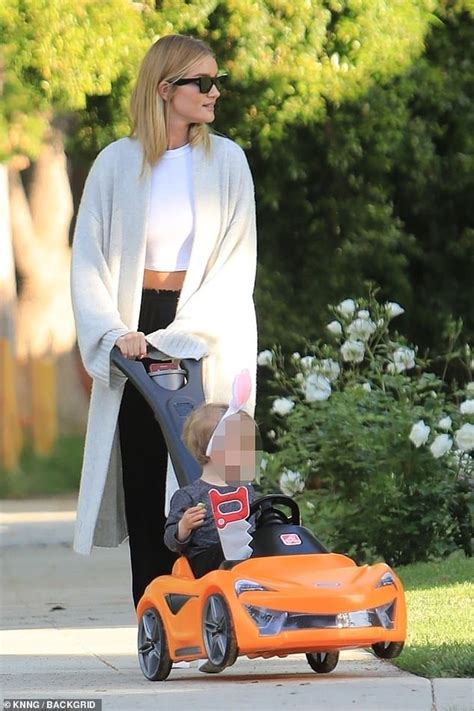 Rosie Huntington Whiteley Is Every Inch The Doting Mum As She Pushes Son Jack In Toy Mclaren