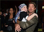 Gerard Butler poses with an adorable little girl while attending a ...