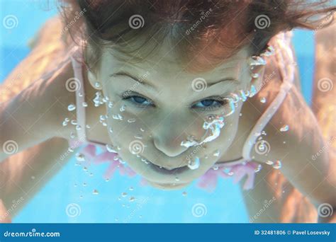 A Young Girl With Open Eyes Dives Under The Water Royalty Free Stock Image Image 32481806