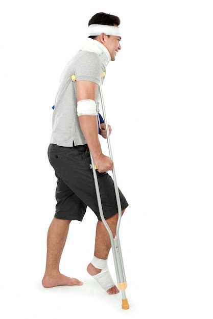 Premium Photo Young Man With Broken Leg On Crutch
