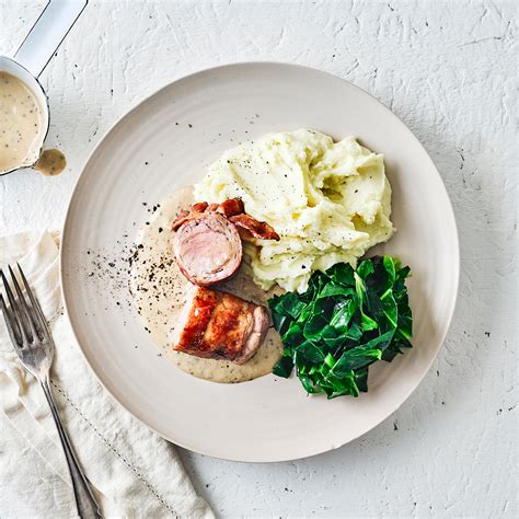 The bacon adds flavor and fat to the lean meat, making it juicy and flavorful. Bacon-Wrapped Pork Tenderloin, Mash & Greens Recipe | Gousto