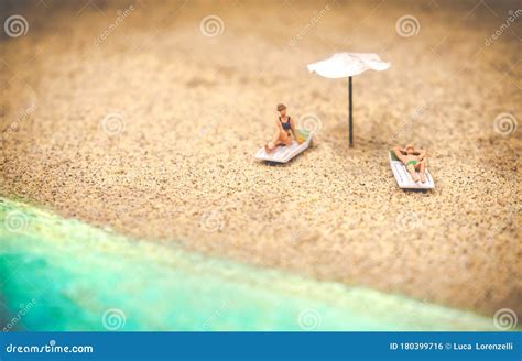 Summer Background Sunbather Couple In Deserted Beach Sunbathing With