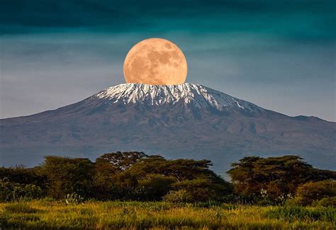 The Full Moon Rises Over Mount Kilimanjaro Tanzania Africa February