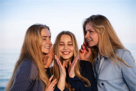 Three Beautiful Teenage Friends Girls Having Fun Near The Sea Stock