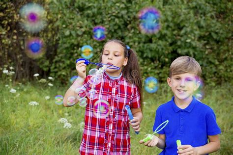 Kids Playing With Bubbles Stock Image Image Of Meadow 105187383