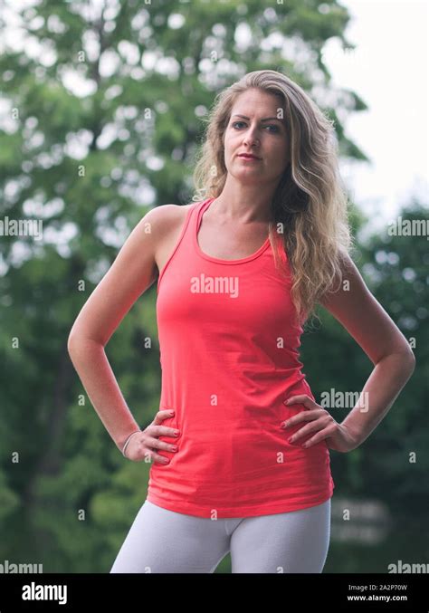 Portrait Of A Sporty Woman In Her Thirties In The Park Stock Photo Alamy