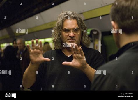 director paul greengrass speaks with matt damon as assassin jason bourne on the set of the