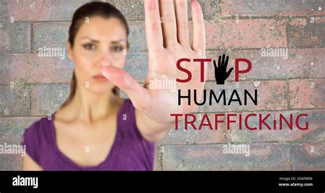 composite of stop human trafficking text and caucasian serious woman showing stop sign against