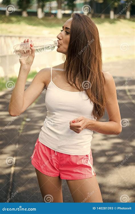 Thirsty Woman Drink Water From Bottle On Stadium Drinking Water After