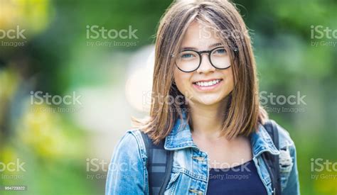 Portrait Of Attractive Young Teenage School Girl With Backpack Stock