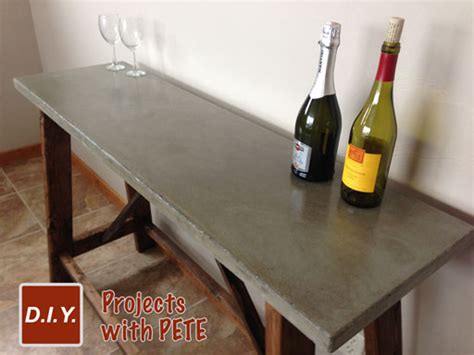 To get the air bubbles out, gently pick up the bucket and tap it on the ground. How to Build a DIY Concrete Table for Beginners - DIY Pete