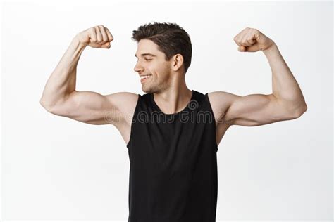 Portrait Of Male Athlete Smiling Sportsman Flexing Biceps Looking