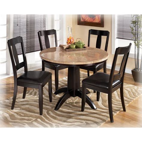 This round small dining table constitutes a perfect proposition for daily meals. D451-225 Ashley Furniture Naomi Round Dining Table/4 Chairs