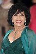 Dame Shirley Bassey, 82, dazzles in a plunging emerald ballgown ...