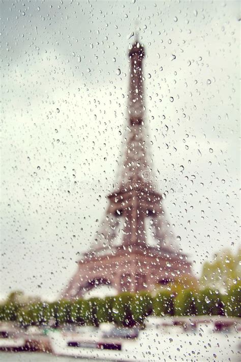 View On The Eiffel Tower Through The Window With Rain Drops Stock