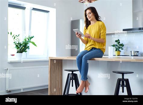 Woman Sitting On Bar Stool Hi Res Stock Photography And Images Alamy