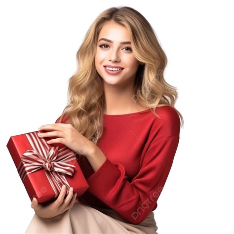 فتاة جميلة تجلس على شجرة عيد الميلاد وتحمل صندوقًا به هدية فتاة عيد الميلاد امرأة عيد الميلاد