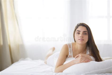Pretty Woman Lying Down On Her Bed At Home Stock Photo Image Of