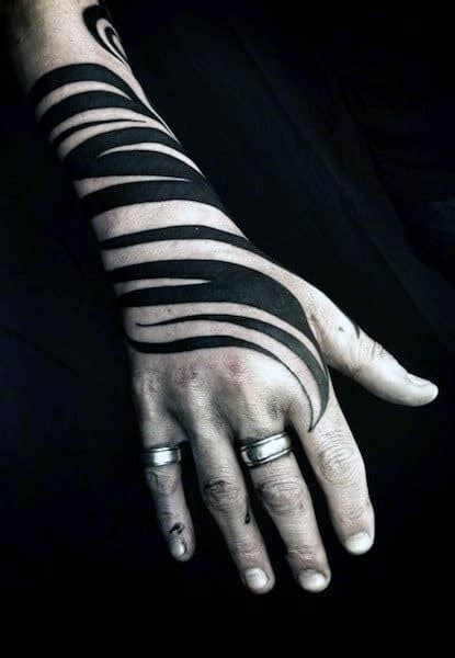 From small, simple ideas to colorful lions, skulls, warriors, eyes, and 3d ink, we've put together the best tattoos for the back of your hand. 40 Tribal Hand Tattoos For Men - Manly Ink Design Ideas