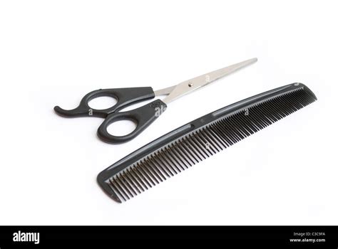 Pair Of Scissors And Comb Isolated On White Background Stock Photo Alamy