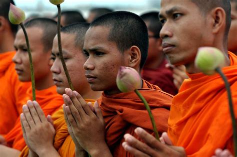 Buddhist Monks Pray During A March For Peace In Front Of The Royal