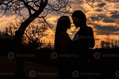 Silhouette Of Romantic Couple In Love Man And Women In Sunset Sky