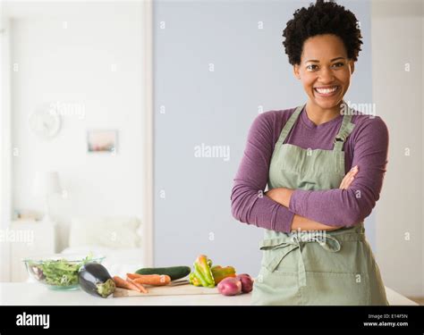 Portrait Of Black Woman Cooking In Kitchen Stock Photo Alamy