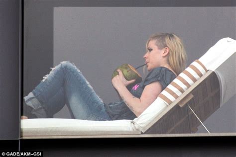 Avril Lavigne Lands In Rio For A Concert And Some Coconut Juice At The