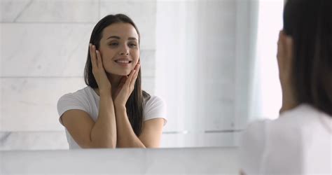 Mirror Reflection Of Young Happy Woman Touching Soft Skin Stock Video
