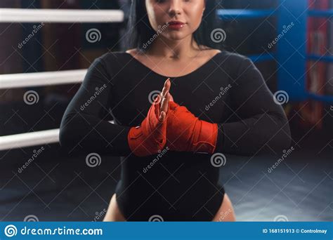 Boxer Woman Hands With Red Boxing Wraps In The Boxing Ring Close Up