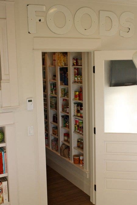 Additional pullout storage was custom designed under the stairs allowing for pantry, brooms and other utility items. I like this look for under the stairs | Under stairs, Pantry wall, Under stairs pantry